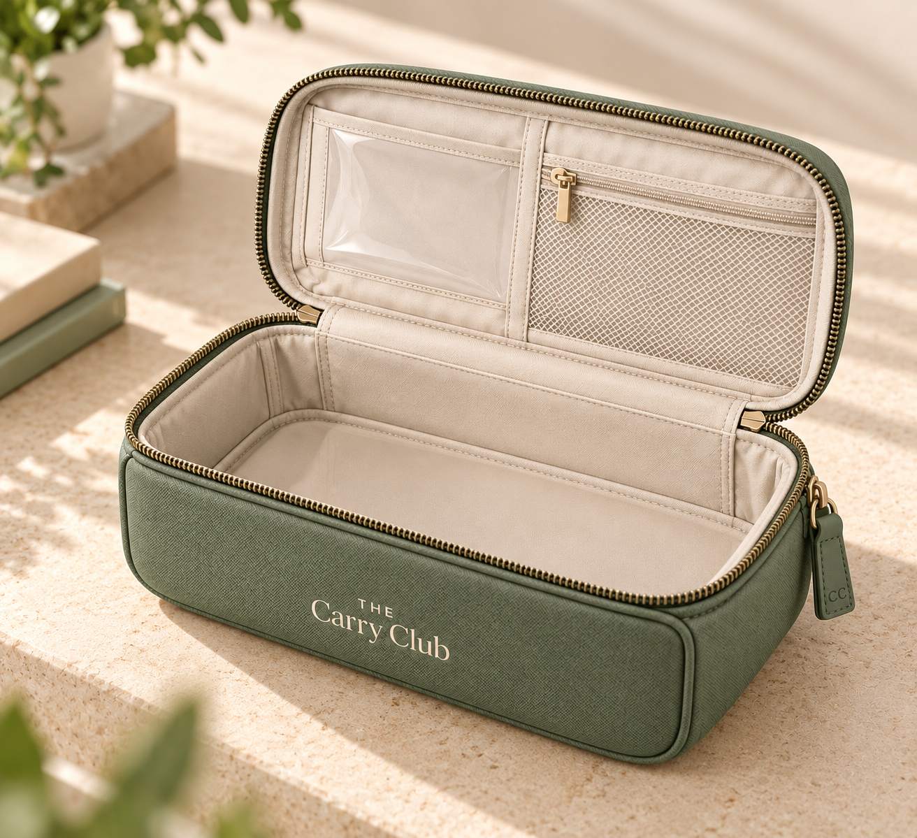 The Carry Club Sage Everyday Organiser open, showing its spacious cream interior, clear card slot and zipped mesh pocket